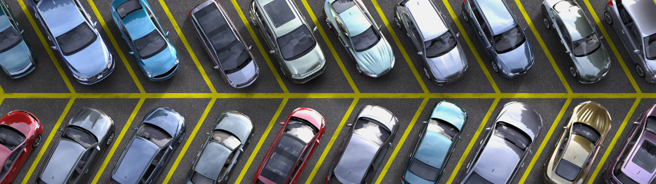 Top view of parked cars in lot.